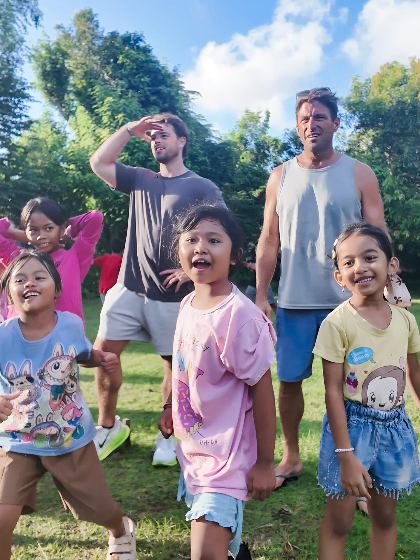 Community volunteers and kids at a Bali give-back event